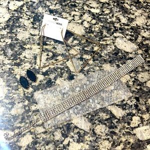 Two earrings and a necklace